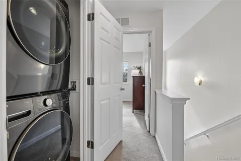 a view of a livingroom with a washer and dryer