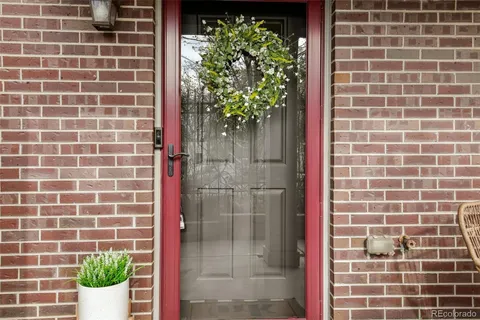 a bathroom with a potted plant and a shower
