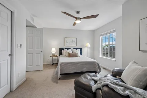 a bedroom with furniture and a window