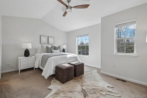 a bed room with a bed and a window