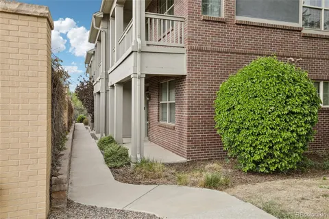 a view of a pathway along the building