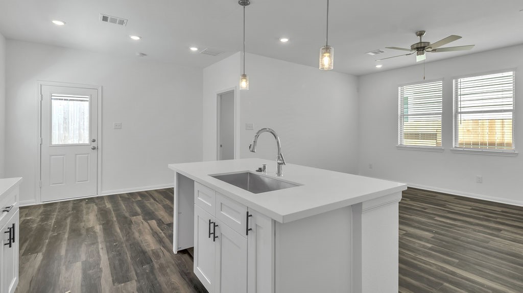 14131 Mellow Pne Court Houston, TX 77032 - Photo 24 of 30 a view of a sink and dishwasher with wooden floor