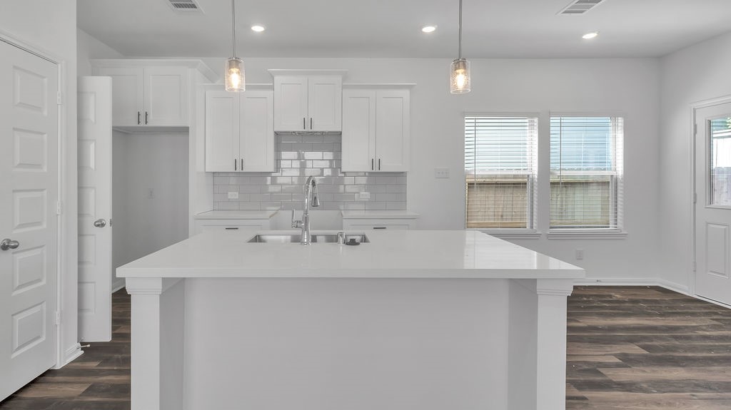 14131 Mellow Pne Court Houston, TX 77032 - Photo 4 of 30 a kitchen with kitchen island a sink stainless steel appliances and window