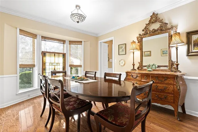 a kitchen with stainless steel appliances a sink stove and cabinets