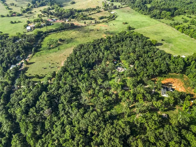 a picture of a room with a small yard and a large window