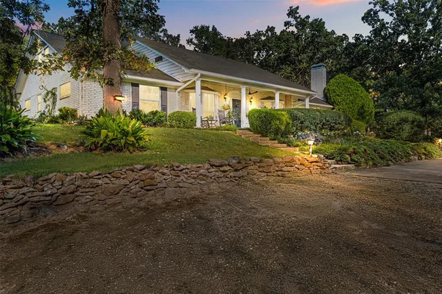 a garden with trees in the background