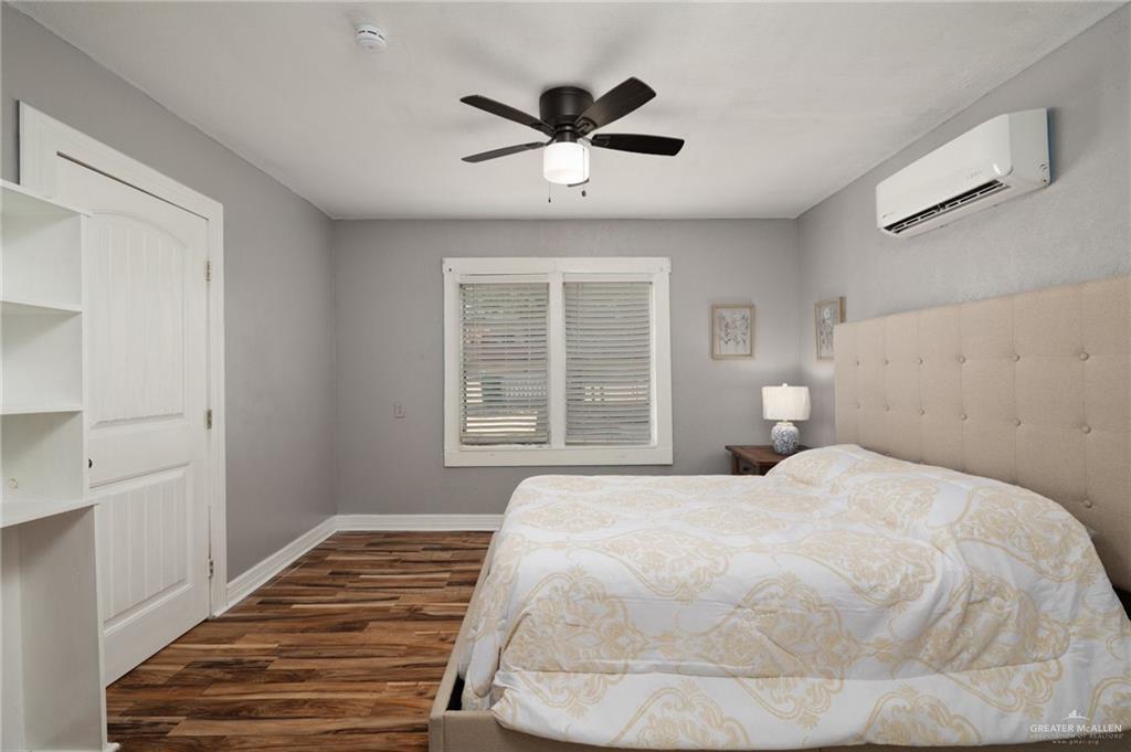 411 East 4th Street Rio Grande City, TX 78582 - Photo 6 of 12 Neutral gray wall paint complementing wood-finish flooring