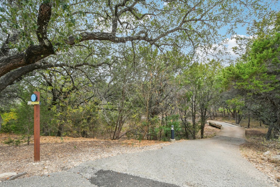17507 Navigation Lane Lago Vista, TX 78645 - Photo 11 of 16 a backyard of a house with lots of trees