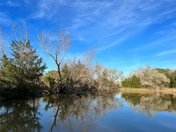 a view of lake with green space
