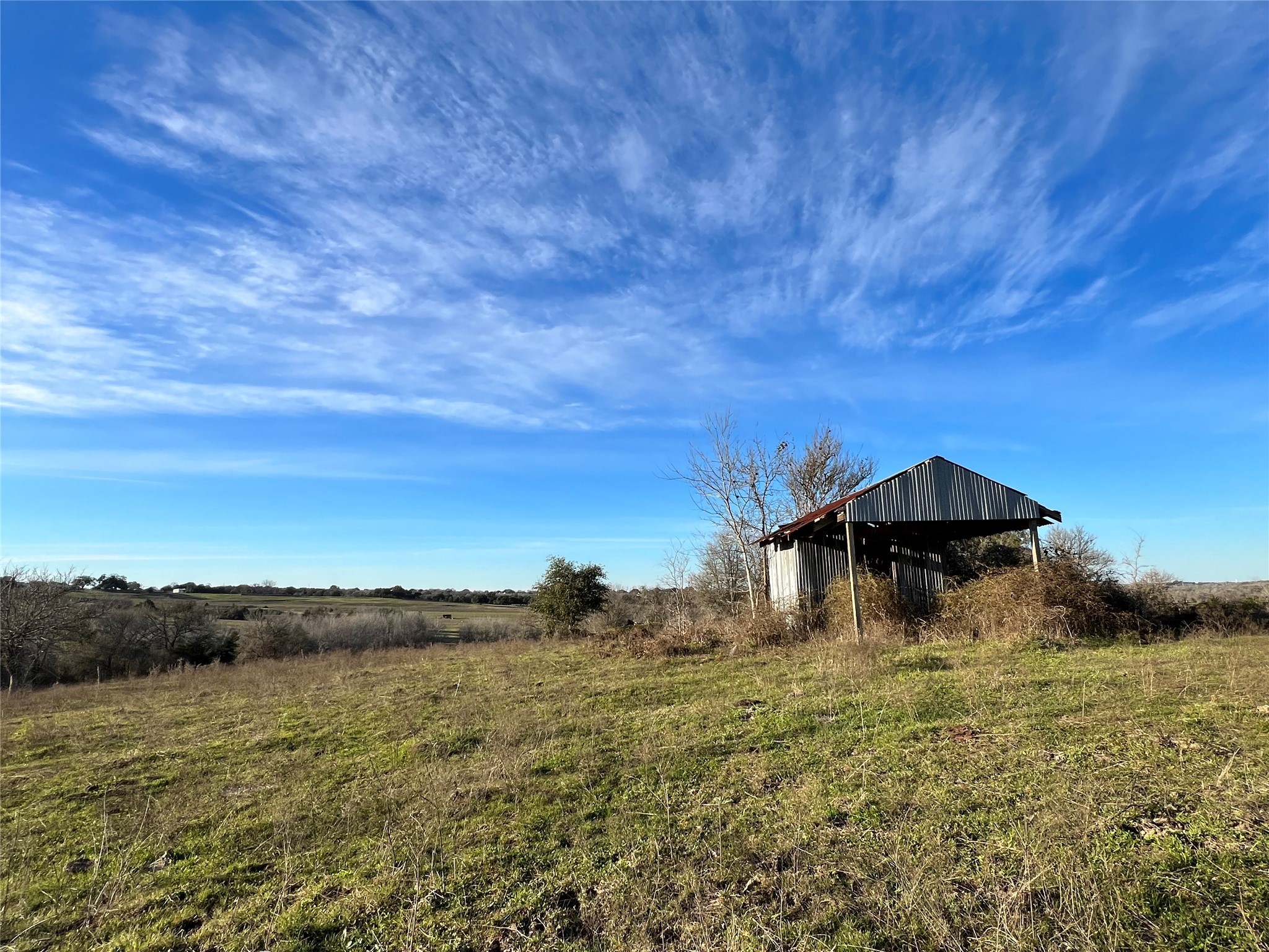 10021 Oil Field Road Brenham, TX 77833 - Photo 13 of 14 a view of a lake with a yard