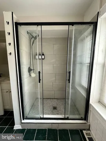 a bathroom with a shower and toilet