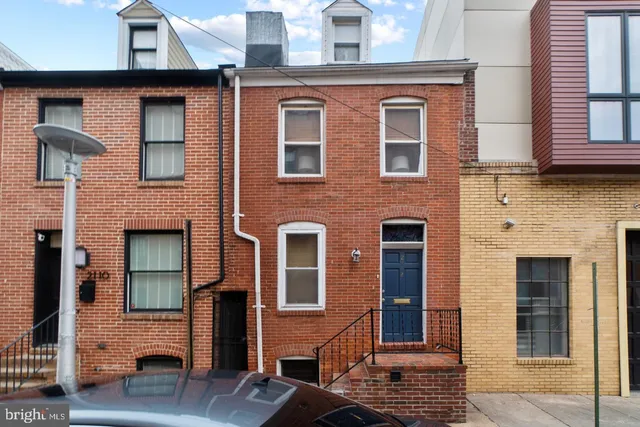 a front view of a house with glass windows