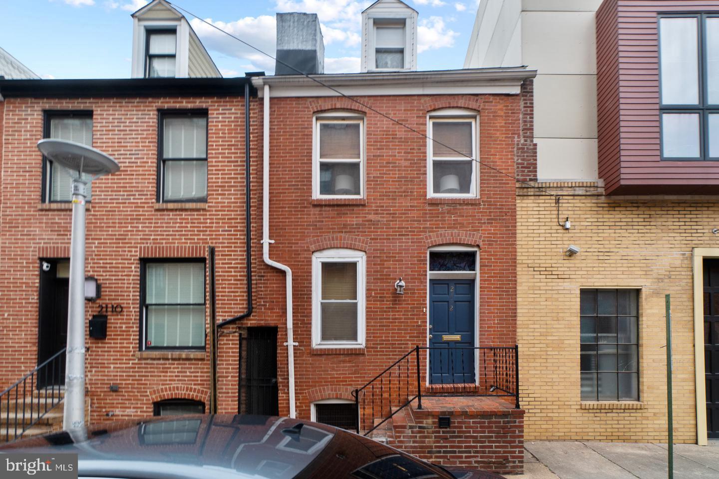 2112 Cambridge Street Baltimore, MD 21231 - Photo 2 of 20 a front view of a house with glass windows