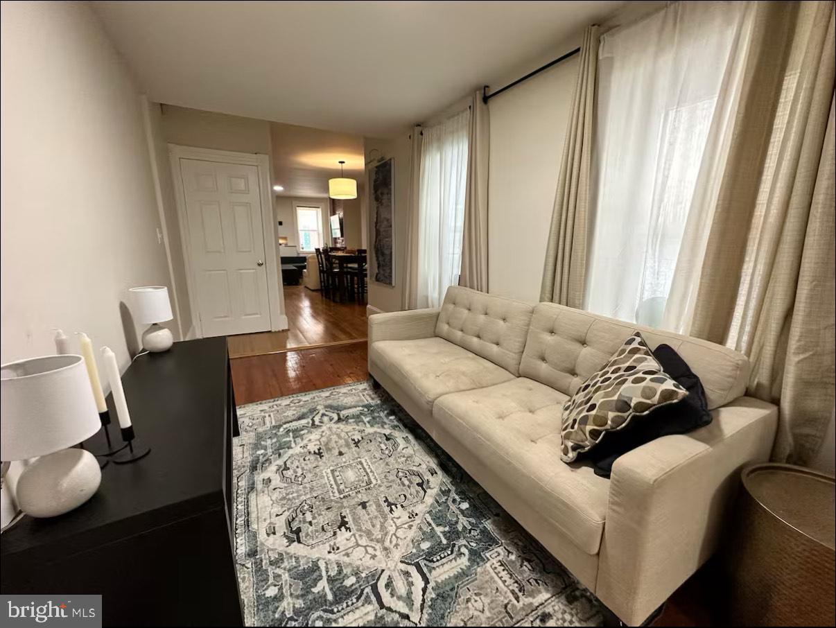 2112 Cambridge Street Baltimore, MD 21231 - Photo 6 of 20 a living room with furniture and a couch