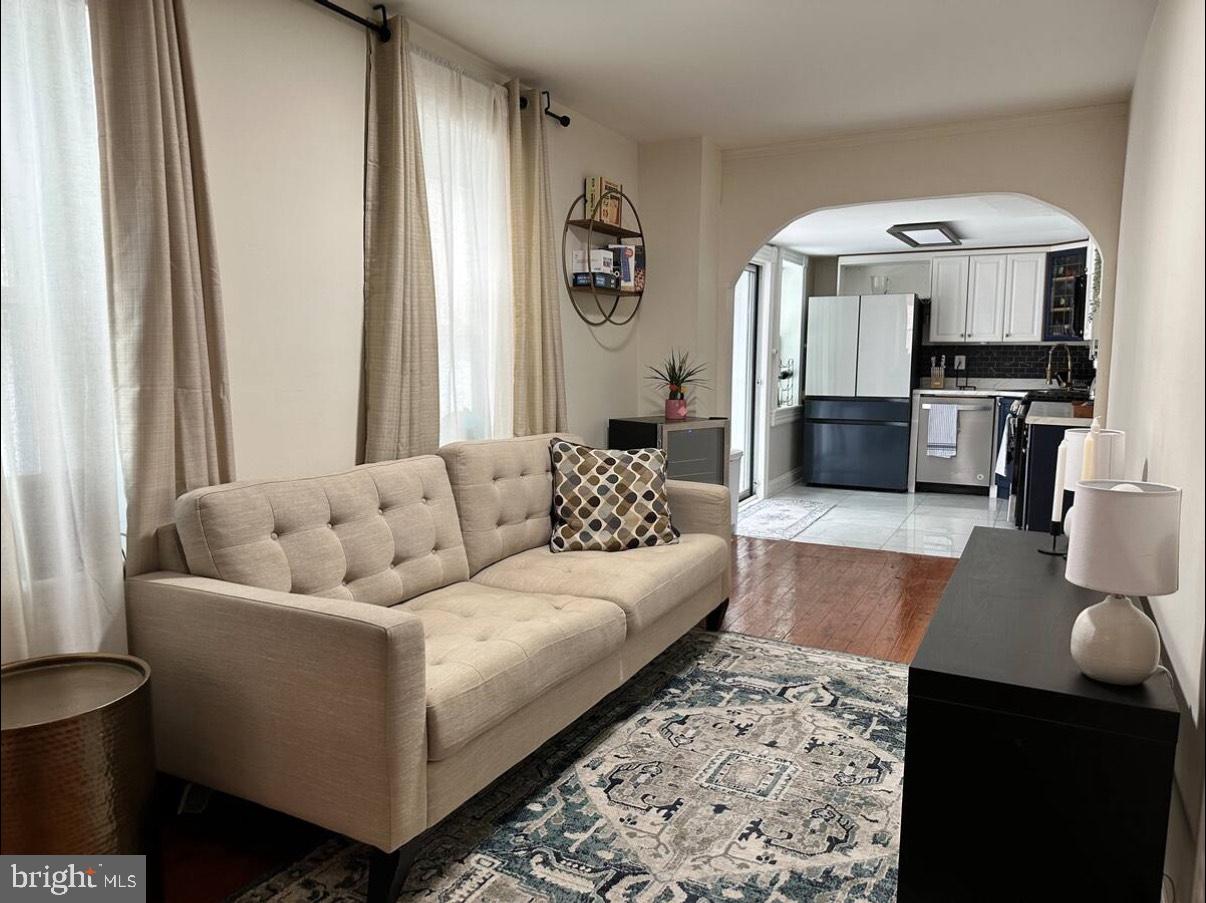 2112 Cambridge Street Baltimore, MD 21231 - Photo 10 of 20 a living room with furniture and a flat screen tv