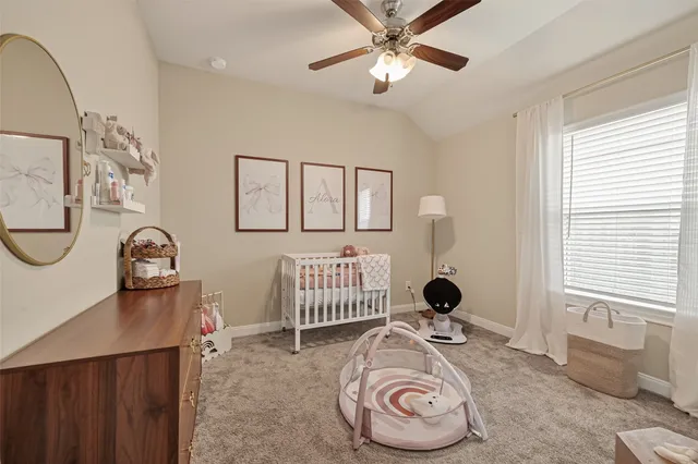 a bedroom with a bed and cabinets