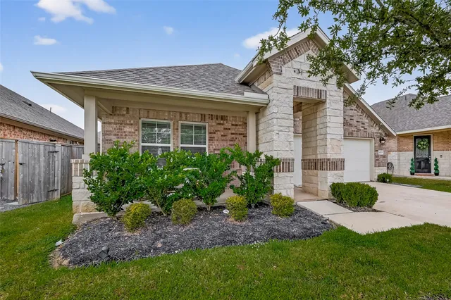 a view of a house with a garden