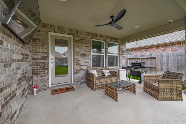 a view of a garden with a house in the background