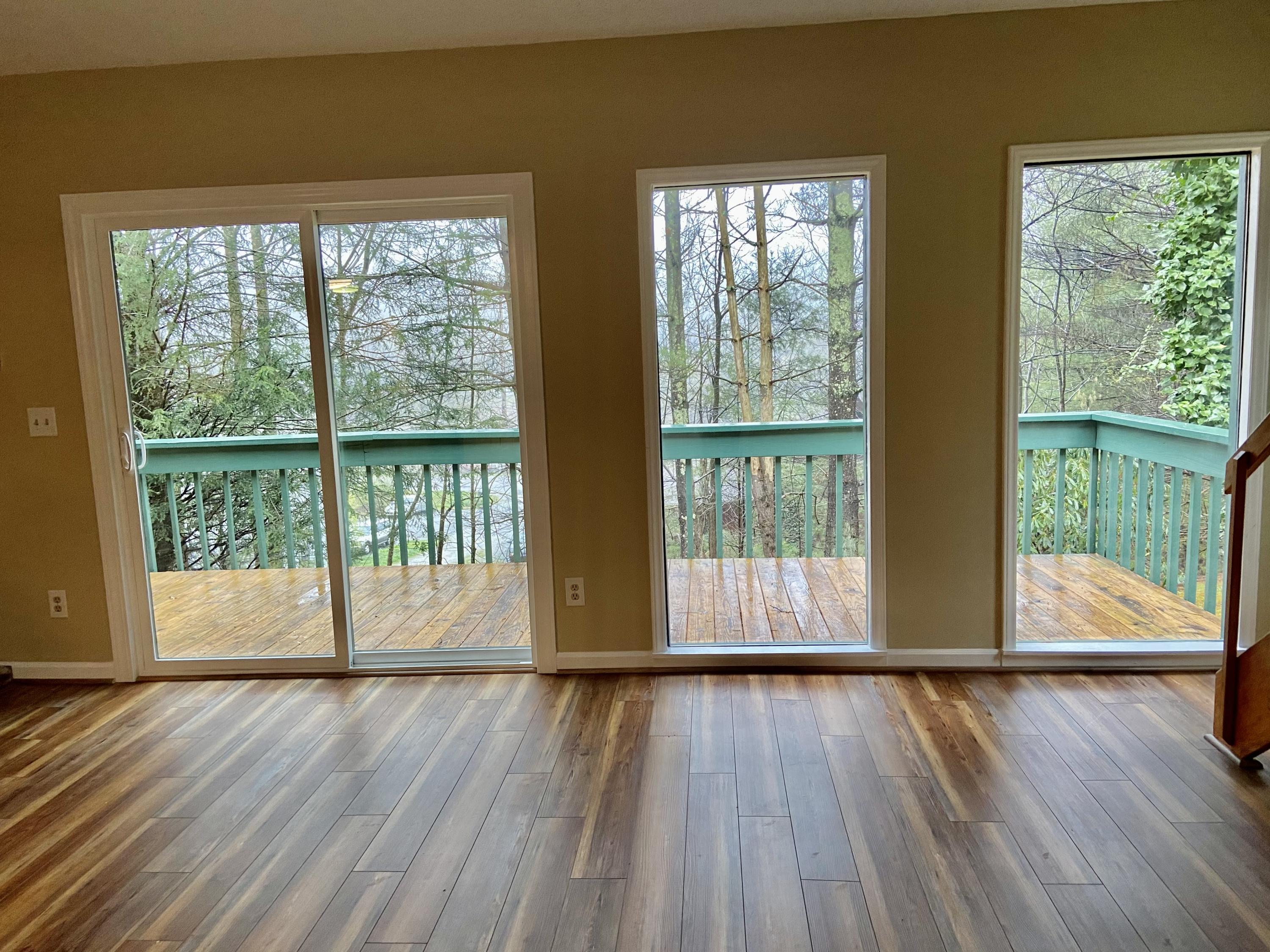 201-3 South Slope Road, Unit N3 Banner Elk, NC 28604 - Photo 25 of 36 LIVING ROOM WINDOWS & DOOR