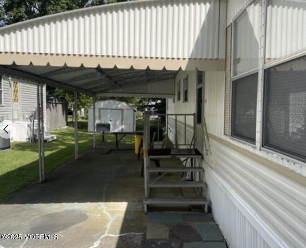 10 Helen Avenue Jackson, NJ 08527 - Photo 11 of 13 a view of a patio with table and chairs with wooden floor and fence