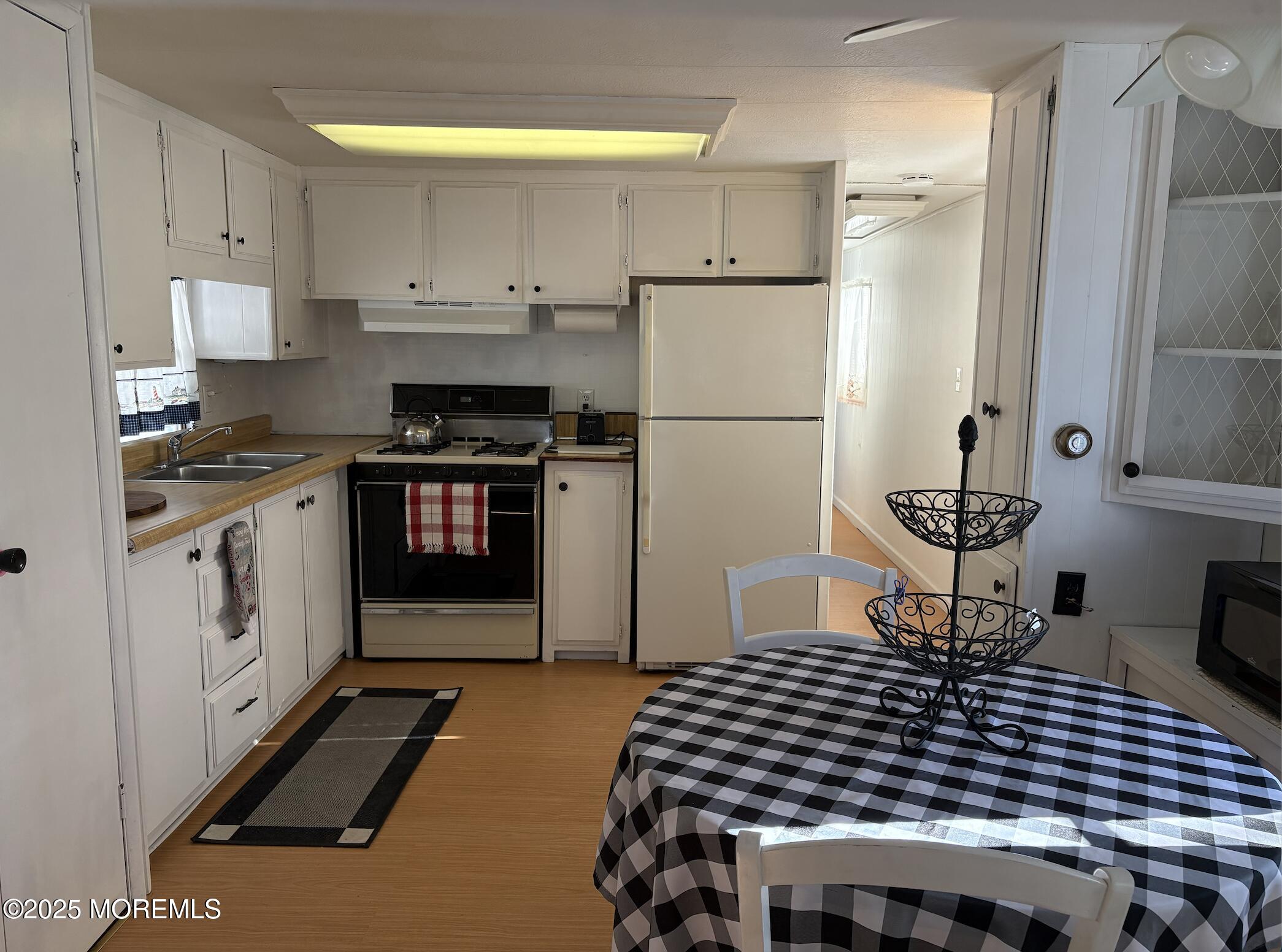10 Helen Avenue Jackson, NJ 08527 - Photo 12 of 13 a kitchen with a stove a refrigerator and a cabinets