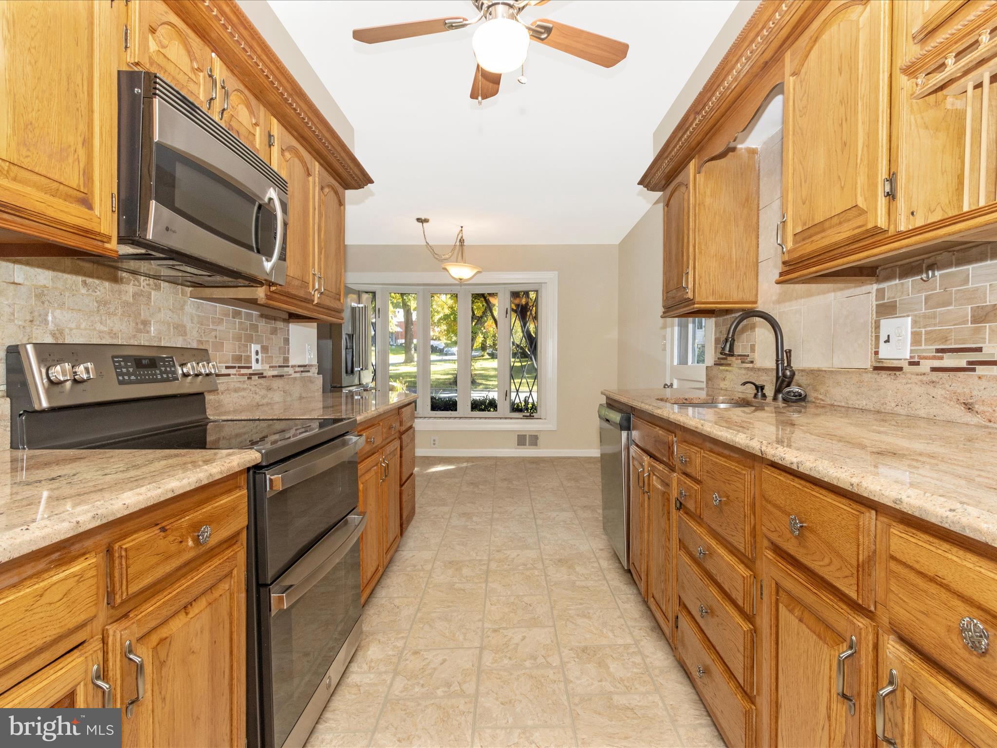 12844 Littleton Street Silver Spring, MD 20906 - Photo 13 of 43 Kitchen with stainless steel appliances