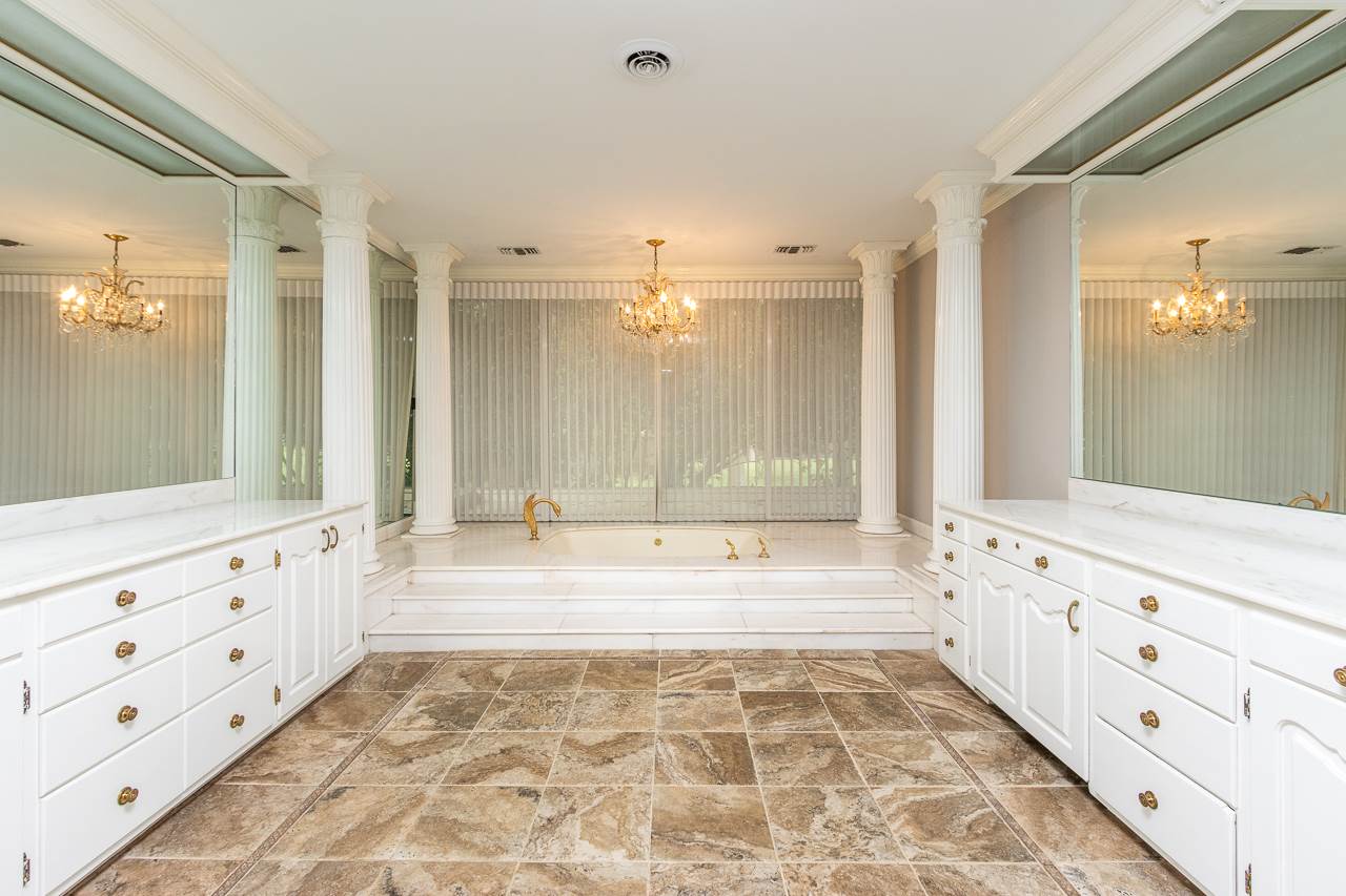 4330 Chickasaw Road Memphis, TN 38117 - Photo 14 of 25 HIS=N-HER VANITIES, FABULOUS CUSTOM GOLD-ACCENTED FAUCETS, PRIVATE TOILET, WALK-IN STEAM SHOWER