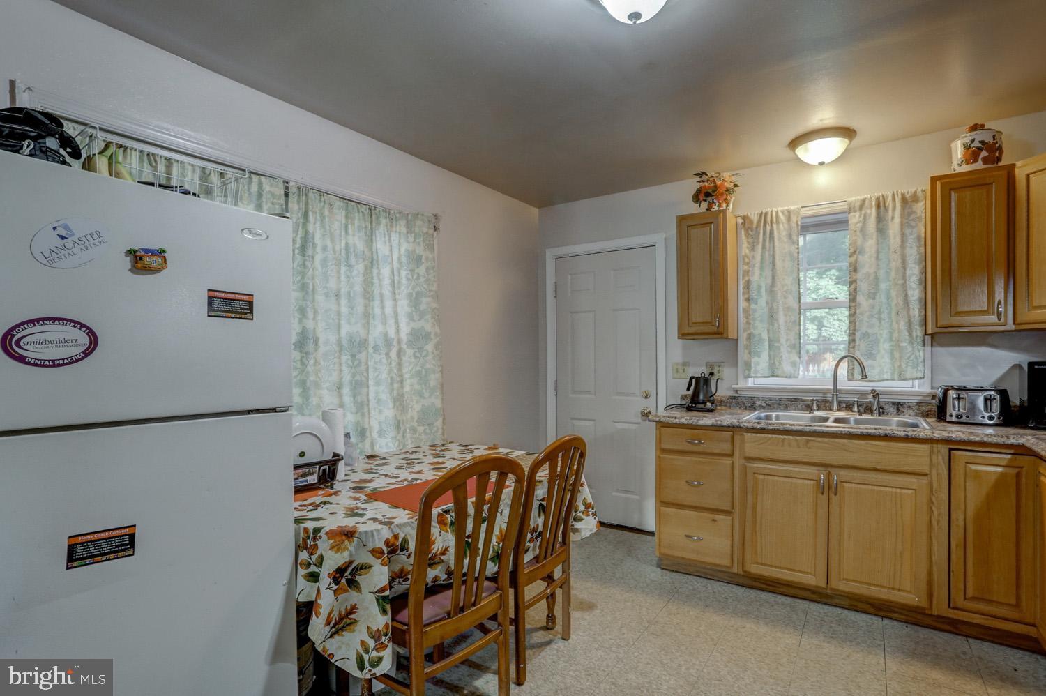 417 Green Street Lancaster, PA 17602 - Photo 17 of 37 a bathroom with a double vanity sink and mirror