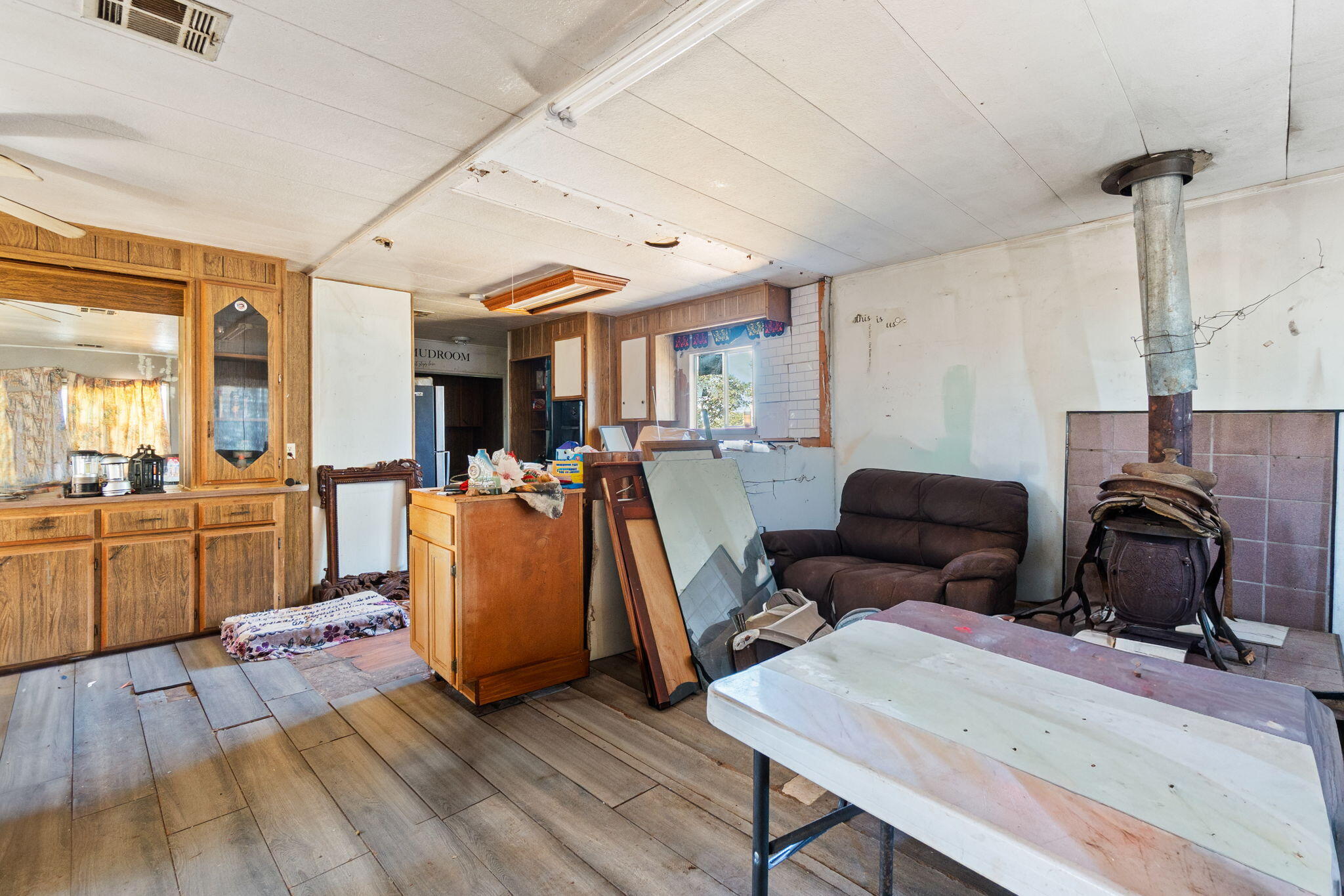 13957 Gas Point Road Igo, CA 96047 - Photo 3 of 18 a living room with furniture a wooden floor and a sink