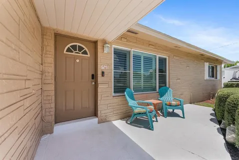 a view of a chairs in front of house