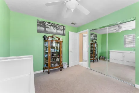 a view of a backyard with sitting area