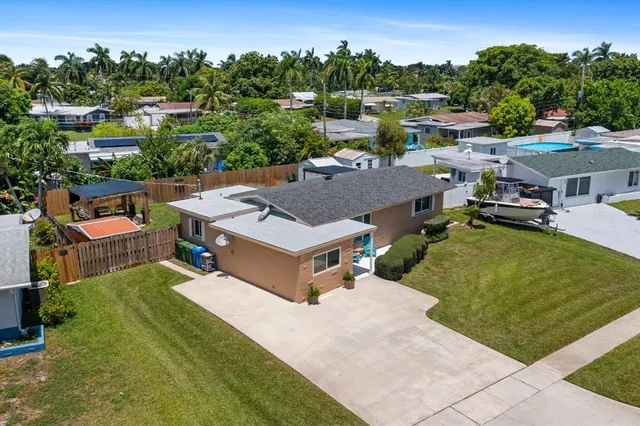 an aerial view of a house with a swimming pool