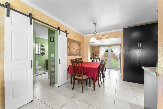 a dining room with furniture and chandelier or bathroom