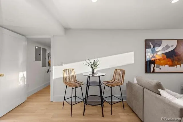 a view of a livingroom with furniture and wooden floor