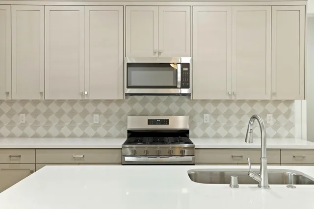 a kitchen with a sink and cabinets