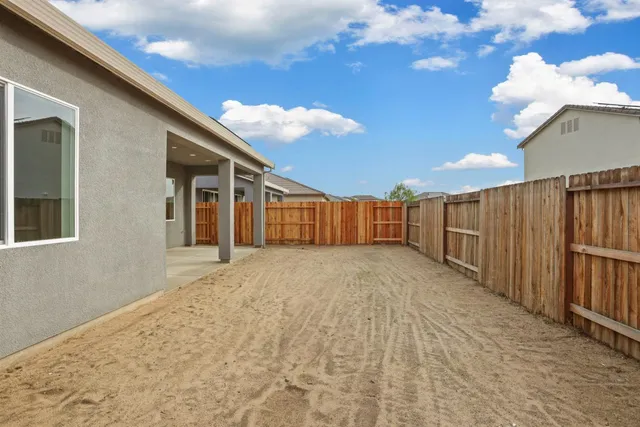 a view of a backyard of the house