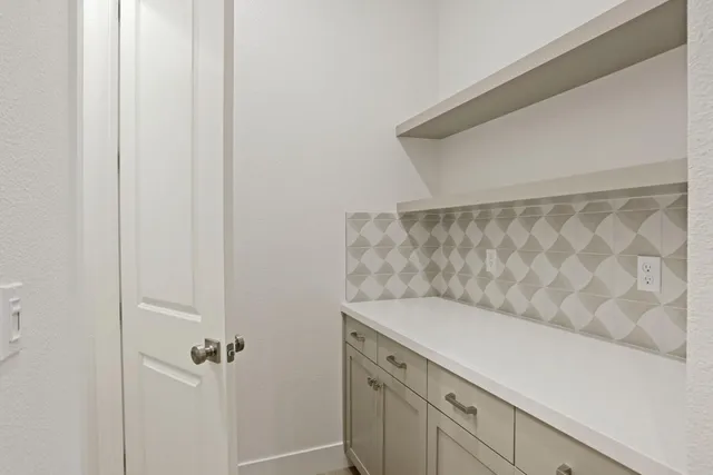 a bathroom with a sink and vanity