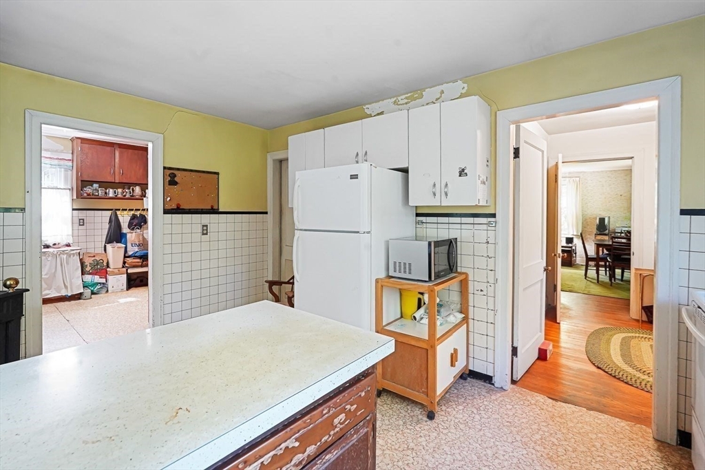 74 River Road Sturbridge, MA 01566 - Photo 11 of 40 a kitchen with stainless steel appliances refrigerator stove microwave and cabinets