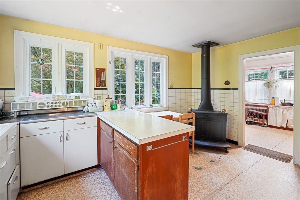74 River Road Sturbridge, MA 01566 - Photo 13 of 40 a kitchen that has a sink and a stove in it