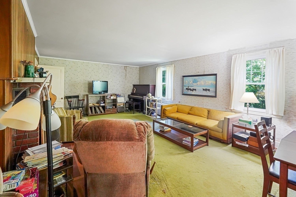 74 River Road Sturbridge, MA 01566 - Photo 18 of 40 a living room with furniture and a window