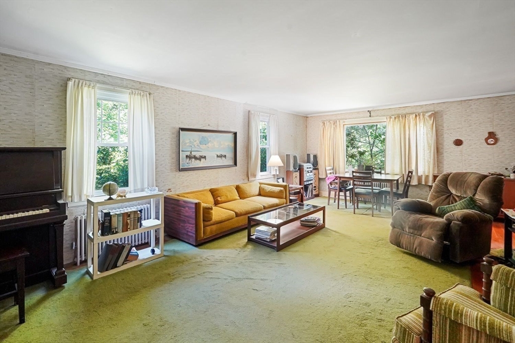 74 River Road Sturbridge, MA 01566 - Photo 19 of 40 a living room with furniture and a flat screen tv