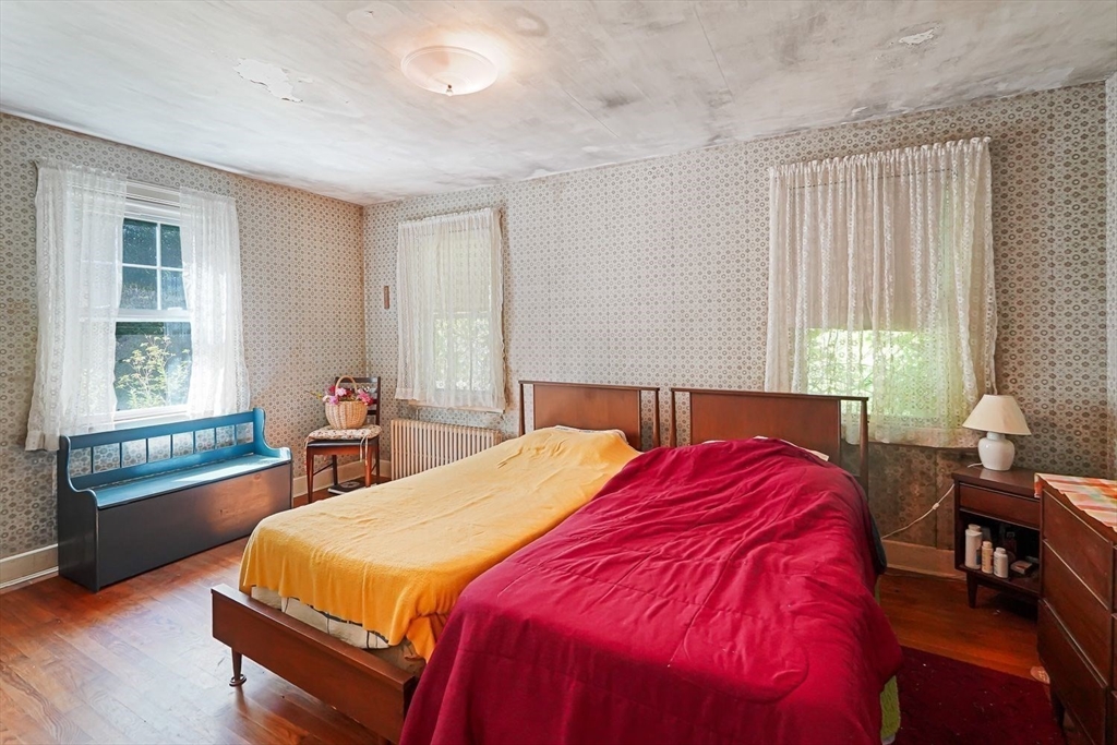 74 River Road Sturbridge, MA 01566 - Photo 23 of 40 a bedroom with a bed and a window