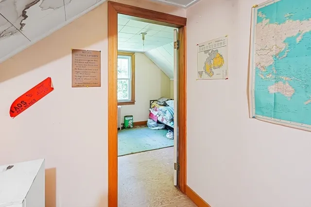 a view of a bedroom & a window