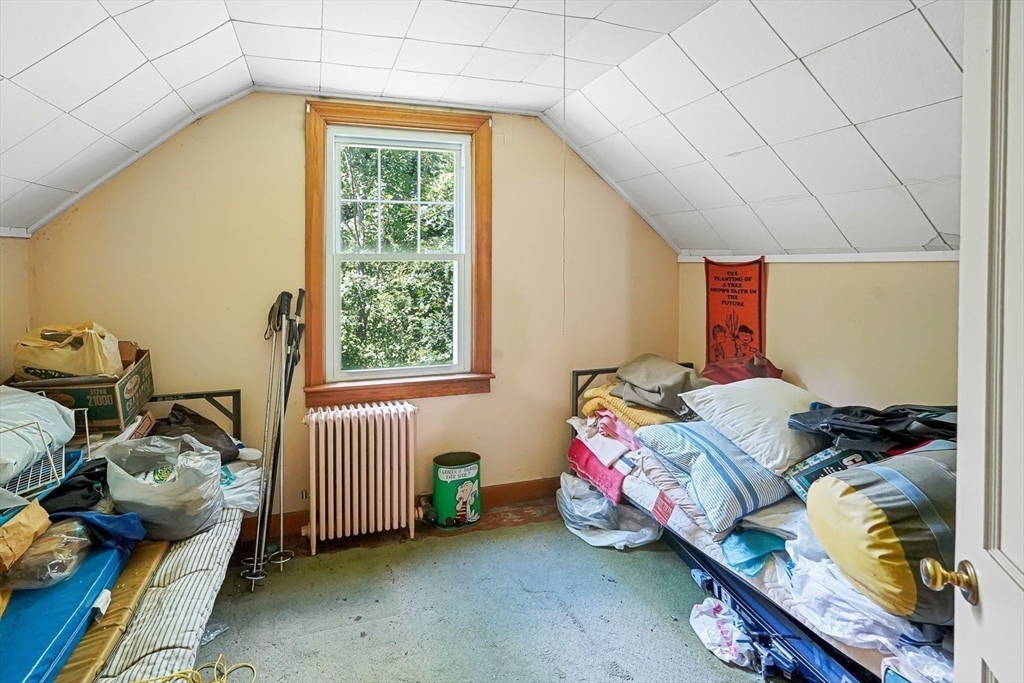 74 River Road Sturbridge, MA 01566 - Photo 28 of 40 a bedroom with a bed and a window