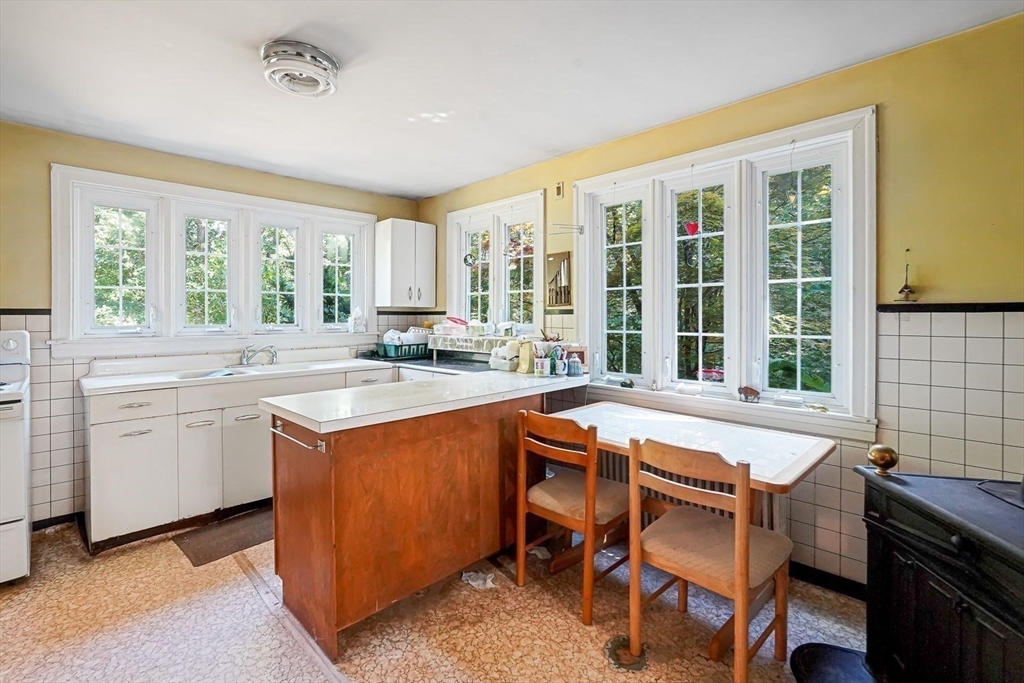 74 River Road Sturbridge, MA 01566 - Photo 9 of 40 a view of a kitchen with granite countertop a sink and a stove