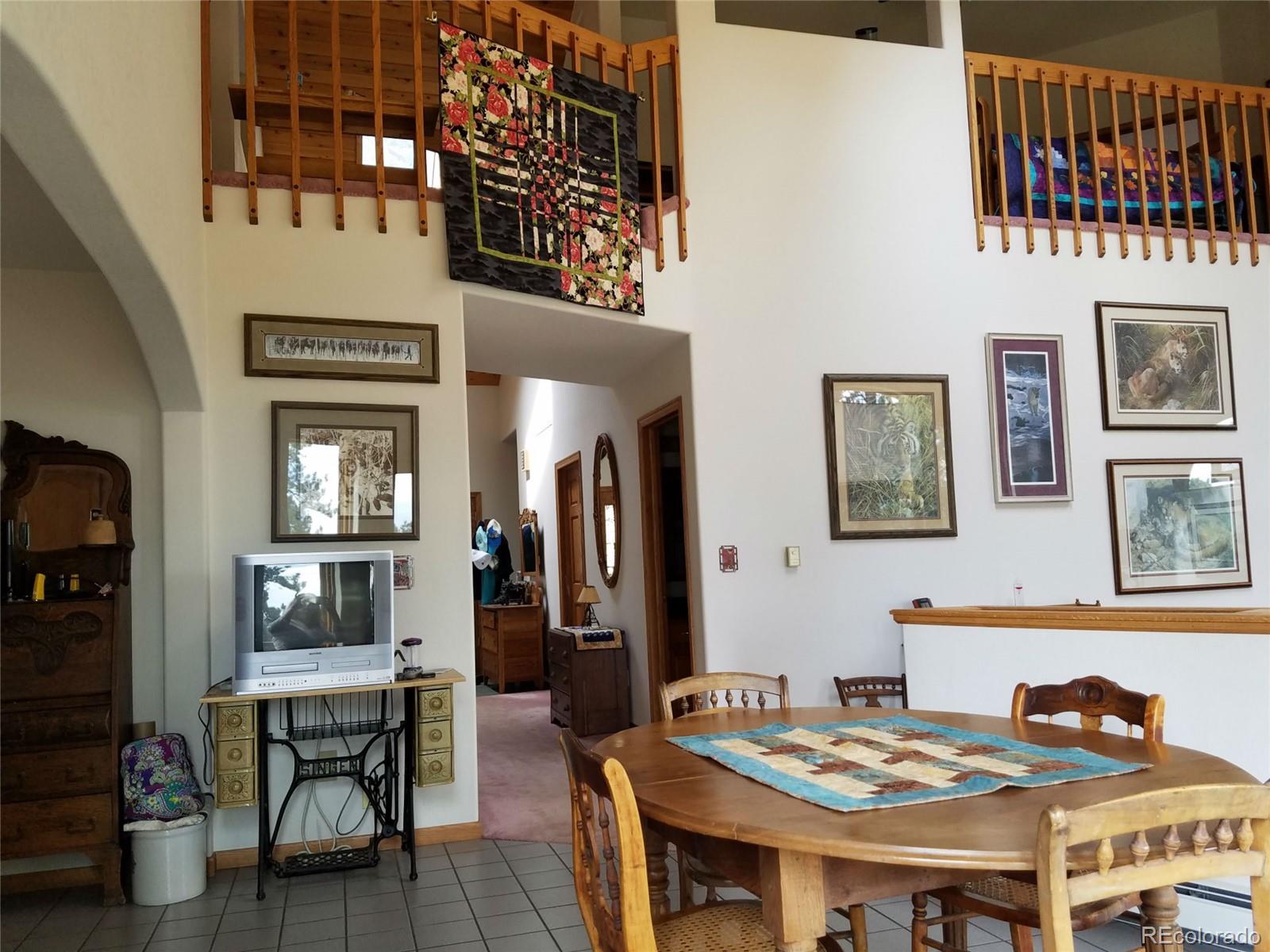 631 Old Corral Road Bailey, CO 80421 - Photo 3 of 35 a view of a dining room with furniture