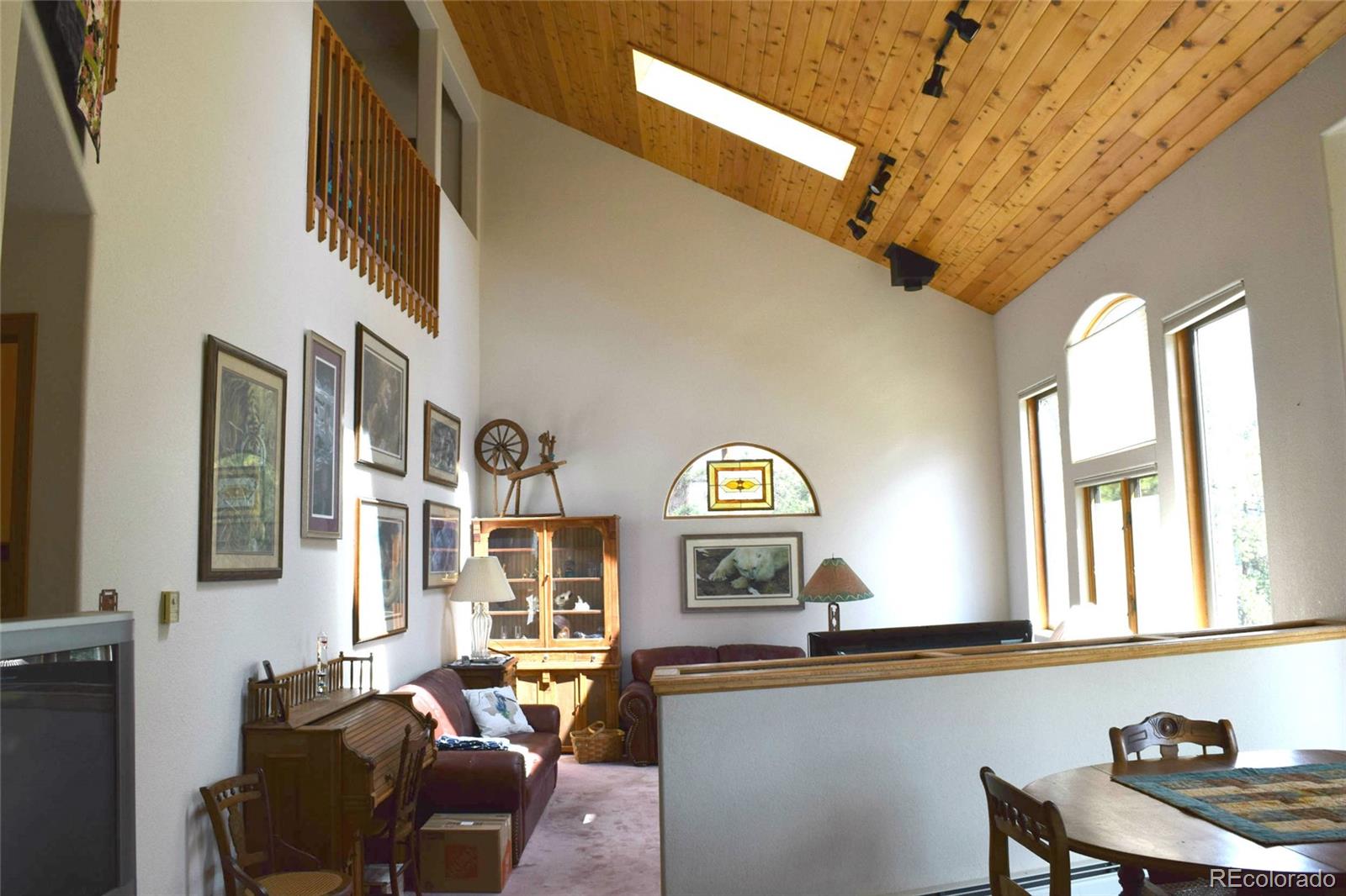 631 Old Corral Road Bailey, CO 80421 - Photo 4 of 35 a living room with furniture and a window