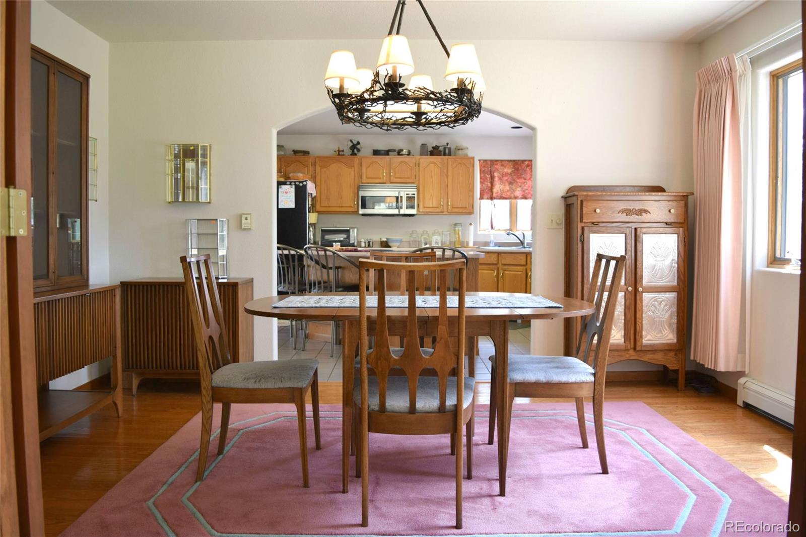 631 Old Corral Road Bailey, CO 80421 - Photo 8 of 35 a view of a dining room with furniture window and wooden floor