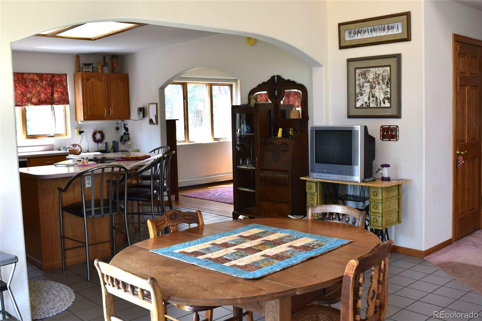 631 Old Corral Road Bailey, CO 80421 - Photo 9 of 35 a view of a dining room with furniture