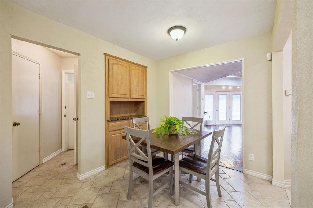 314 Amherst Avenue Richardson, TX 75081 - Photo 13 of 38 a view of a dining room with furniture and window